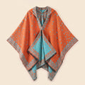 Cape poncho homme ouverte motif bandana orange et bleu clair, présentée à plat, montrant son design réversible