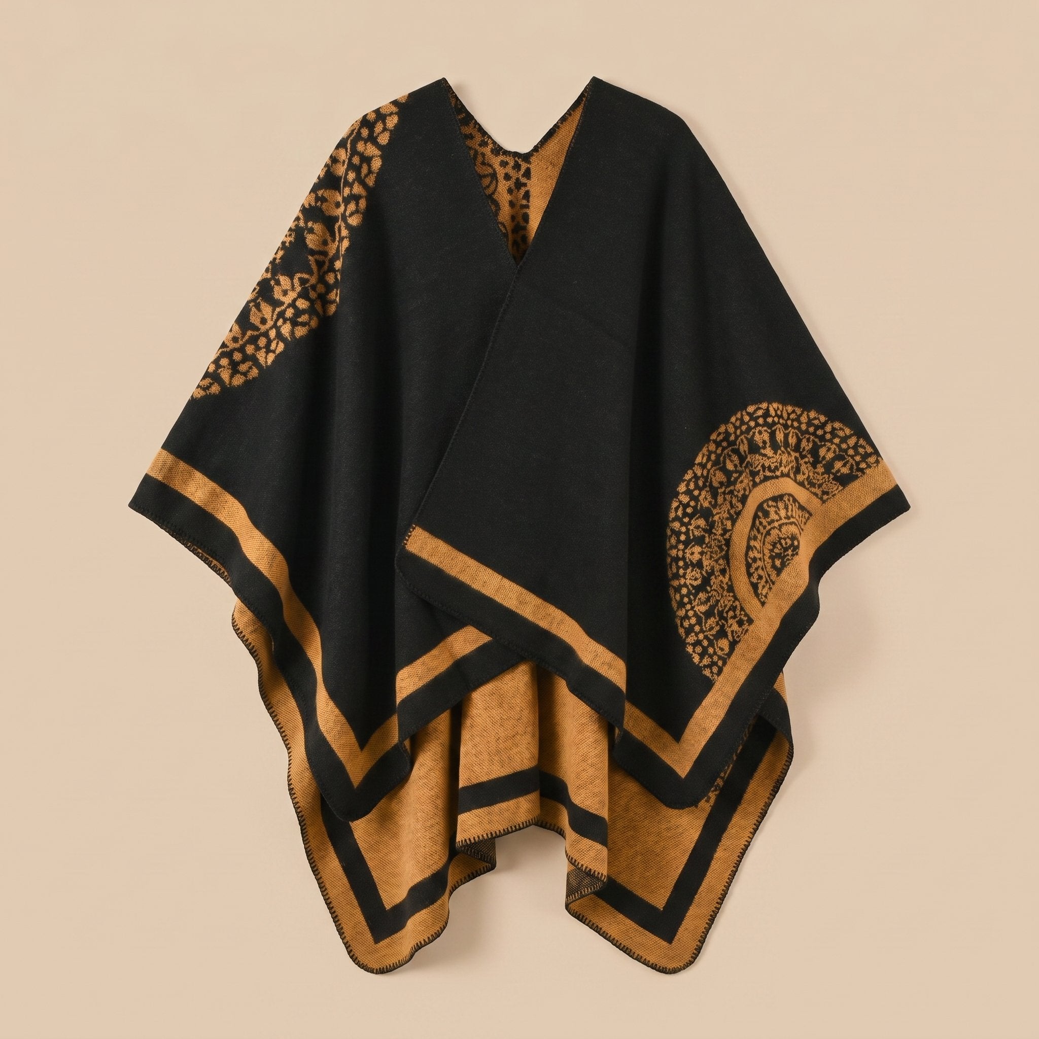 Manteau poncho femme, cape ouverte à bordure noire et marron, avec motifs circulaires et géométriques, posé à plat