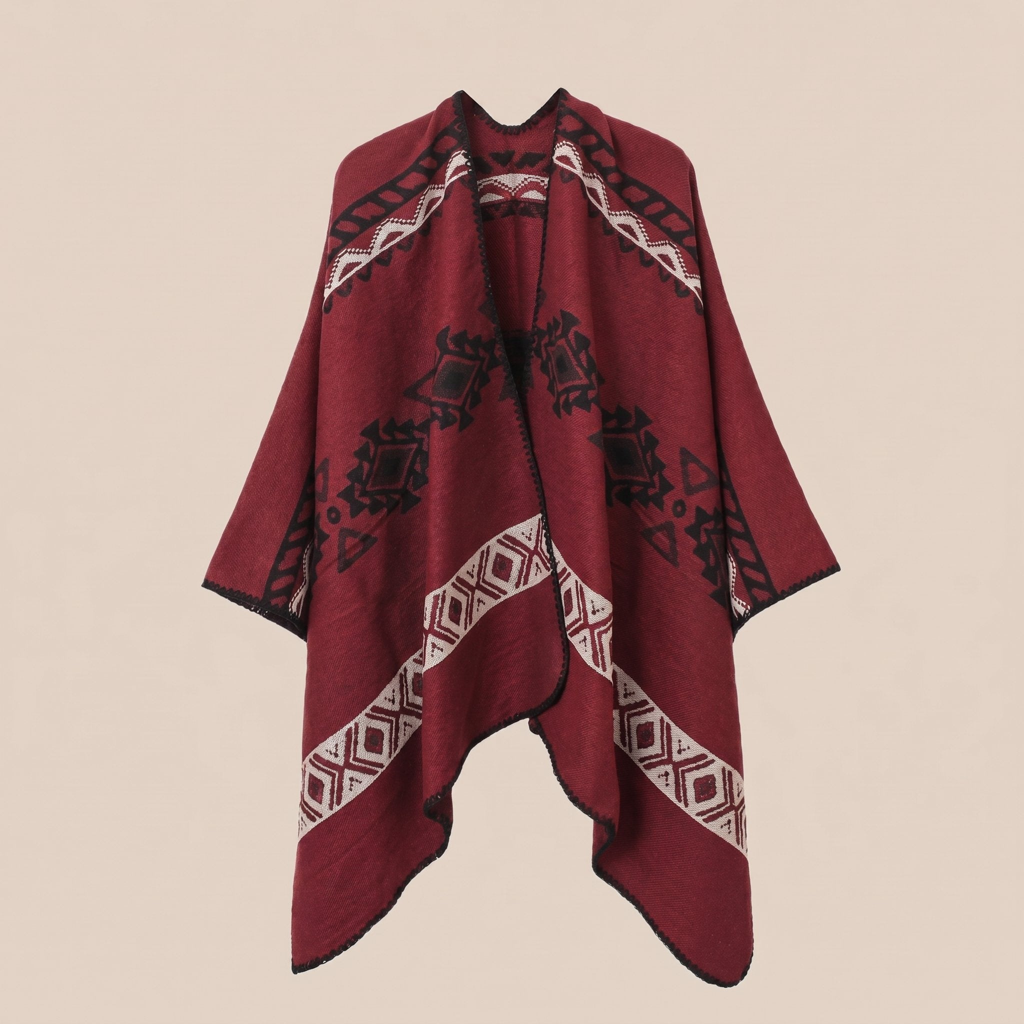 Poncho cape homme ethnique bordeaux, visible à plat sur un fond beige.