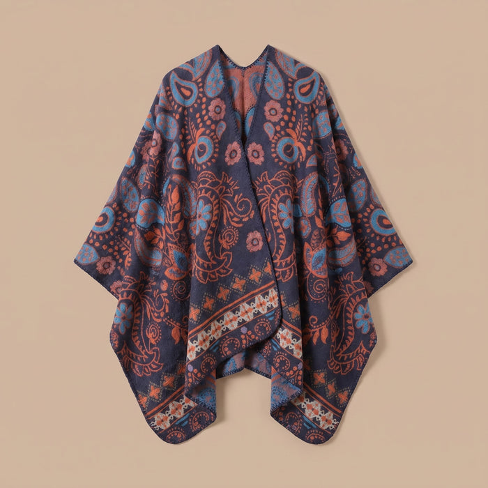 Poncho cape homme paisley bleu présenté à plat sur un fond neutre, montrant la coupe ample et le motif détaillé du tissu
