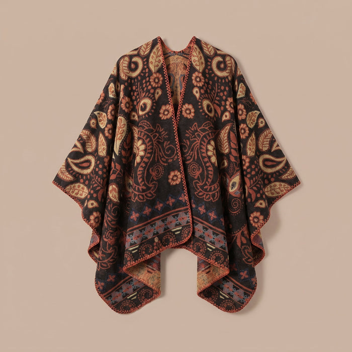 Poncho cape homme motif Paisley cuivre, présenté à plat sur un fond uni pour montrer le motif.