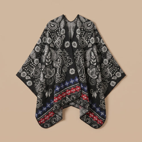 Poncho cape homme paisley noir présenté à plat sur un fond uni