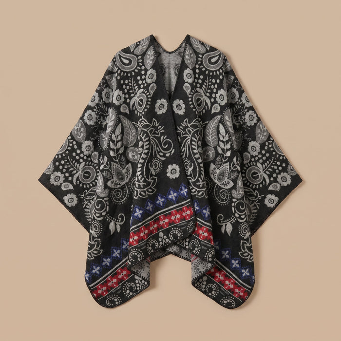 Poncho cape homme paisley noir présenté à plat sur un fond uni