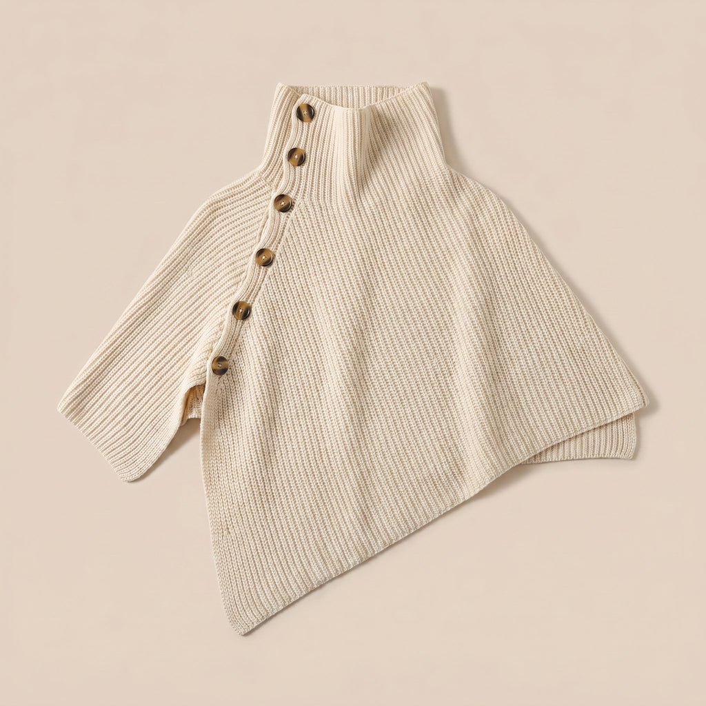 Poncho en laine femme crème, avec col montant et boutons, présenté à plat sur un fond uni.
