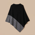 Poncho femme en laine, coupe cape bicolore noir et gris clair, présenté à plat de dos