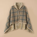 Poncho plaid · Carreaux beiges, présenté à plat, révélant son intérieur douillet en sherpa beige.