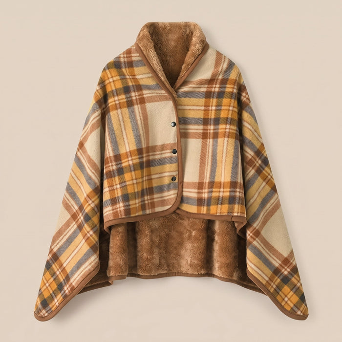 Poncho plaid à carreaux ocre posé à plat, montrant l'intérieur en fausse fourrure marron.