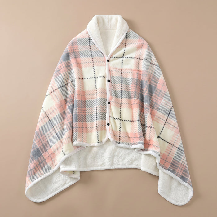 Poncho plaid à carreaux pastel posé à plat, montrant son motif et sa doublure douce.