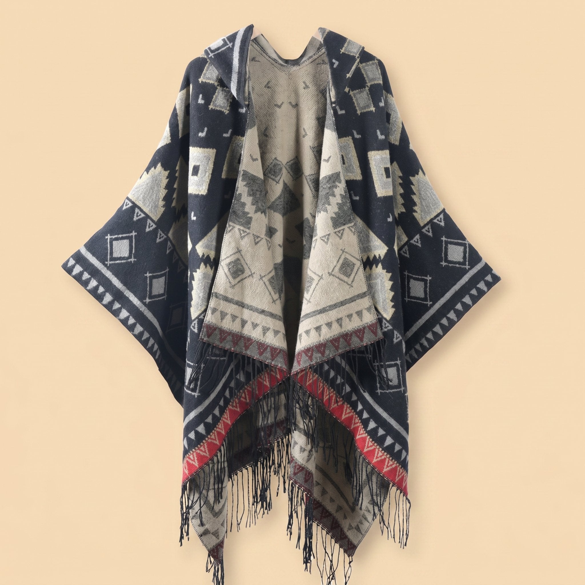 Poncho plaid à capuche motif ethnique, présenté de face avec des franges visibles en bas.