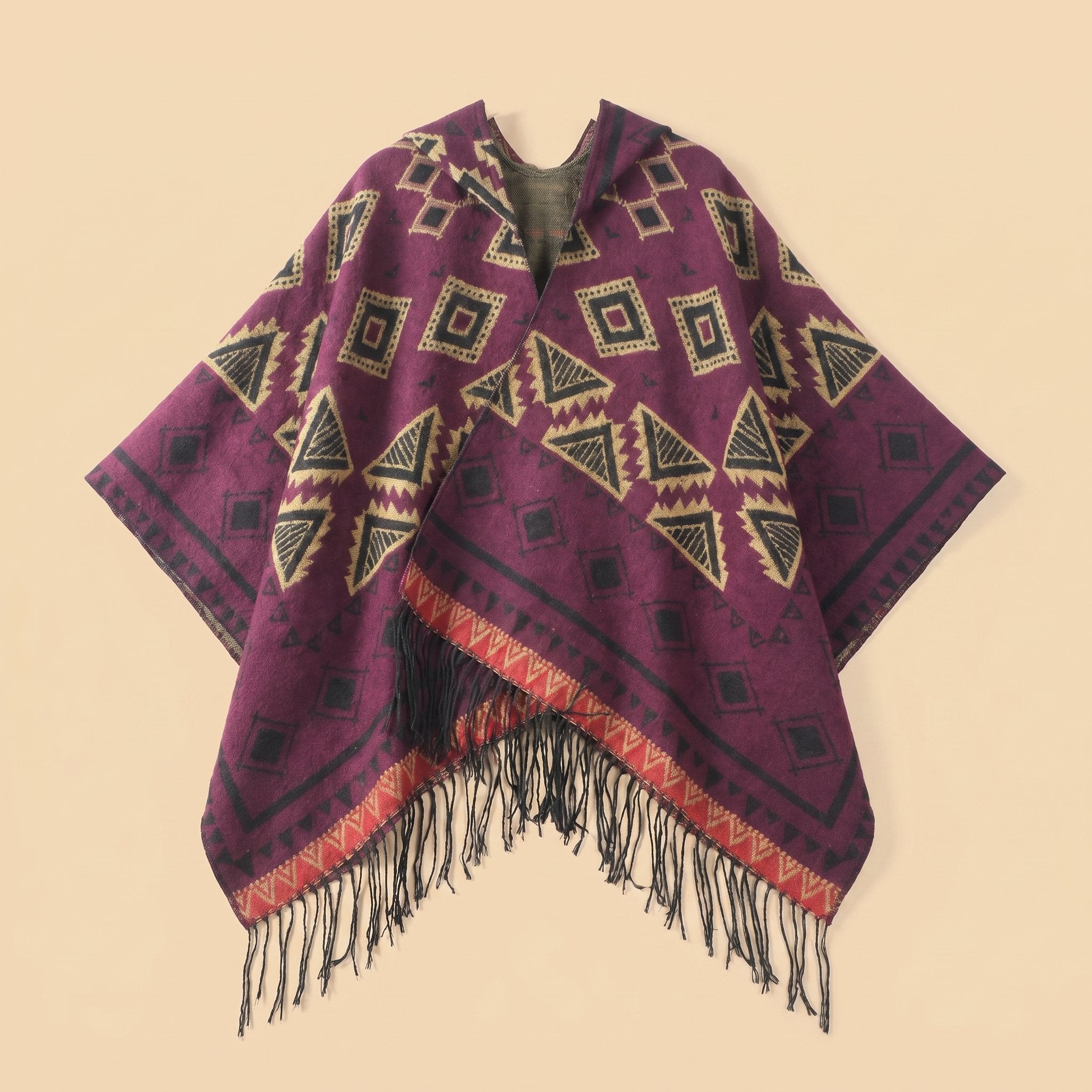 Poncho plaid à capuche motif violet, présenté de face avec des motifs géométriques et des franges.