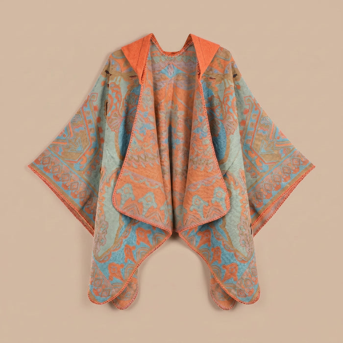 Poncho plaid à capuche motif paisley orange et turquoise, posé à plat, vue de face.