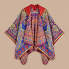 Poncho plaid à capuche motif paisley multicolore, avec des teintes vives, vu de dessus.