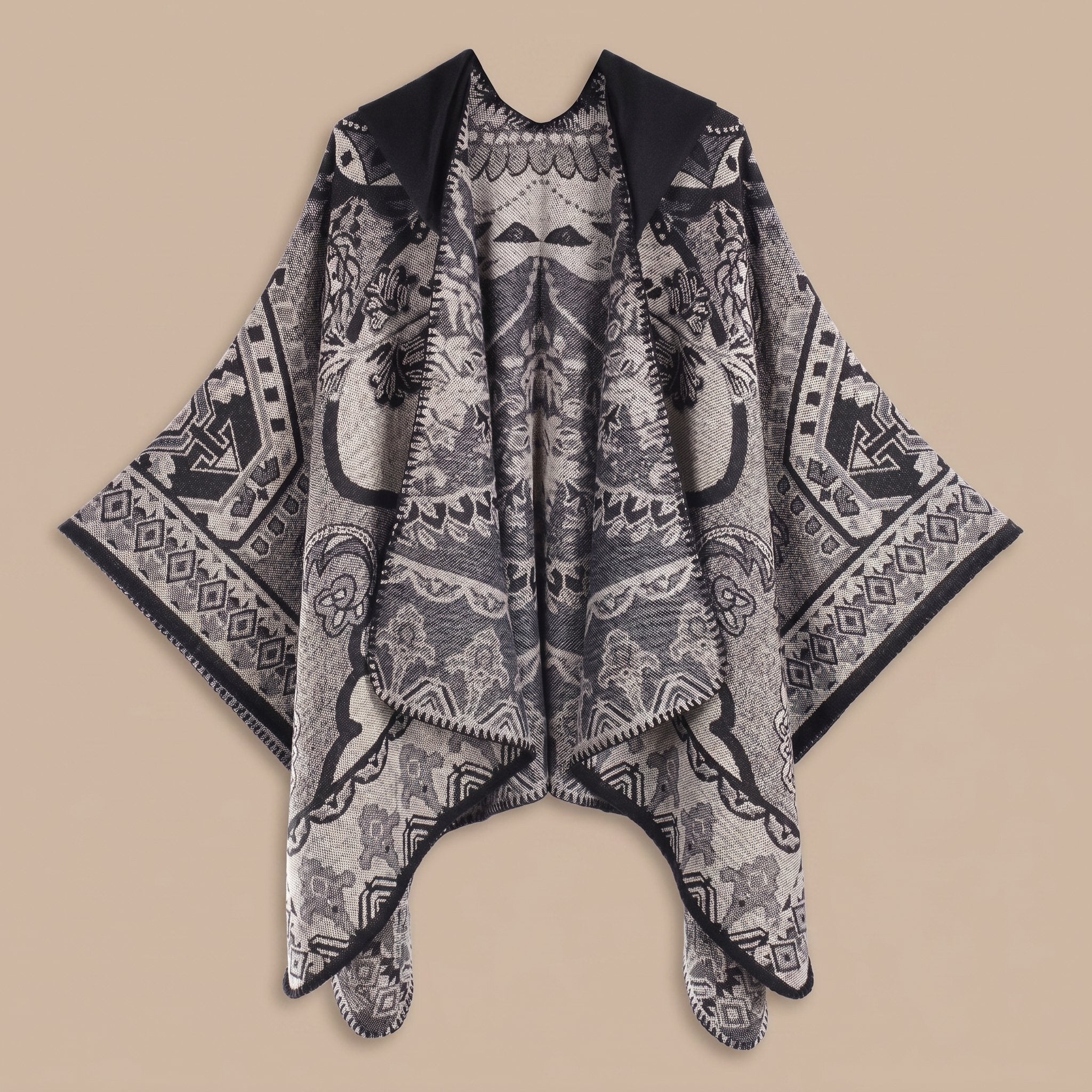 Poncho plaid à capuche motif paisley noir et gris, présenté avec ses motifs détaillés.