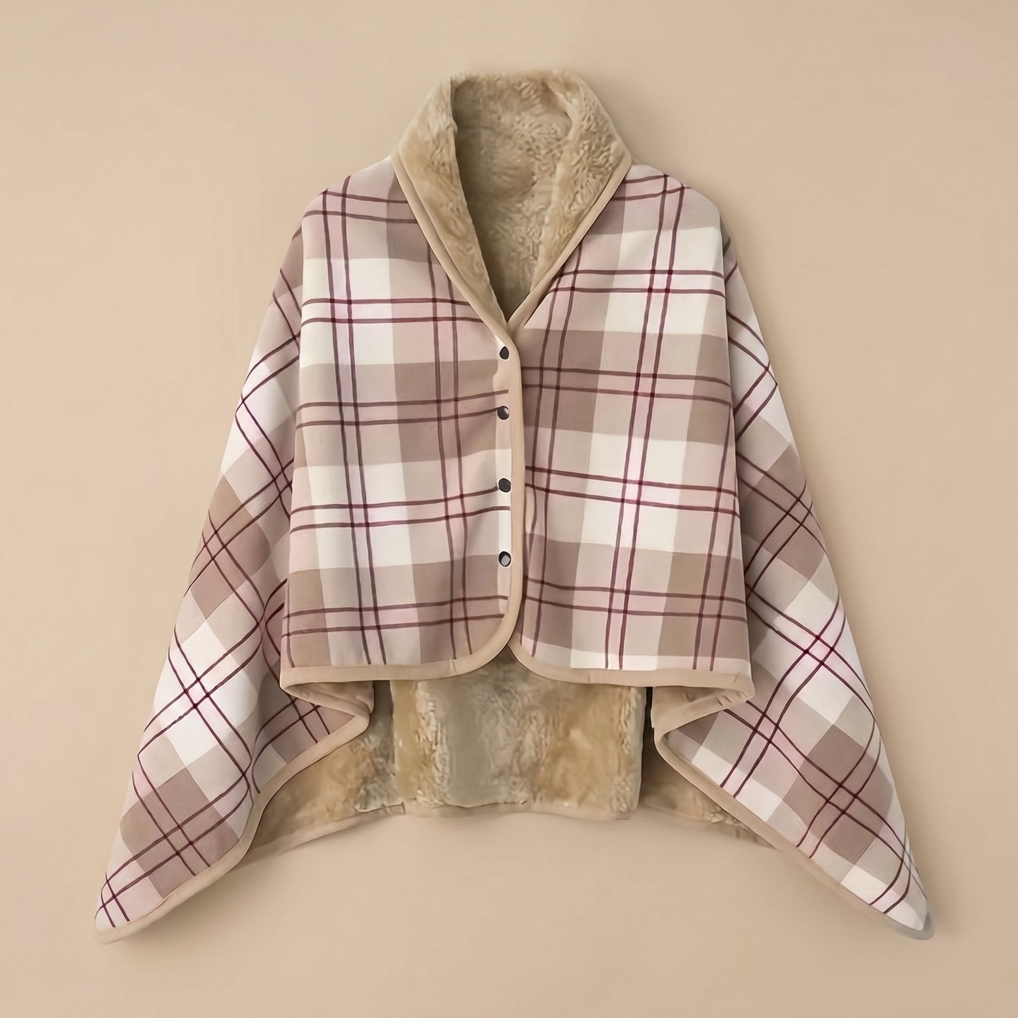 Poncho polaire à carreaux rosés présenté à plat, montrant son intérieur douillet en fausse fourrure.