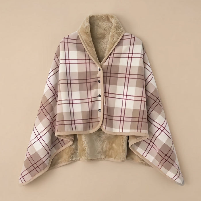 Poncho polaire à carreaux rosés présenté à plat, montrant son intérieur douillet en fausse fourrure.