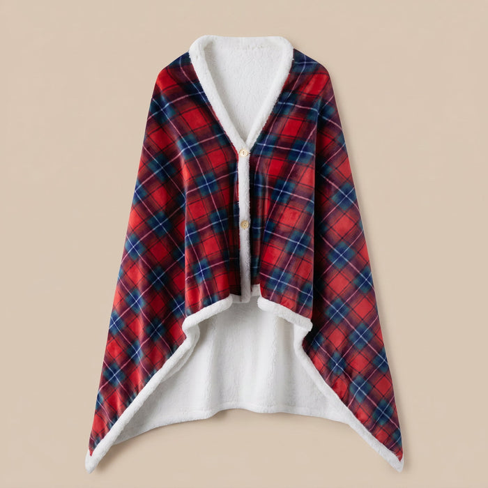 Poncho polaire tartan rouge et bleu présenté à plat, entièrement déplié, montrant son motif et sa doublure.