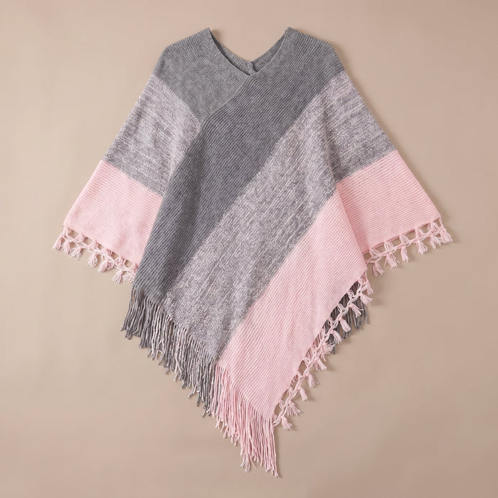 Poncho pull femme colorblock rose et gris, présenté à plat sur un fond uni clair.