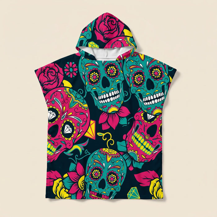 Poncho serviette à capuche adulte Crânes mexicains : vue à plat sur fond crème